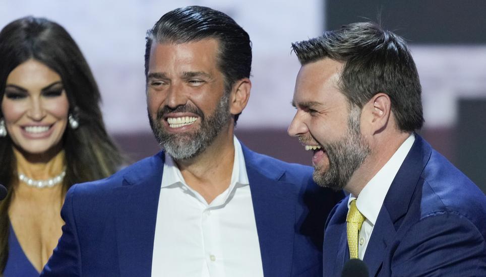 Republican vice presidential candidate Sen. JD Vance, R-Ohio, right, talking with Donald Trump Jr., center, and Kimberly Guilfoyle, left, during the walkthrough for the Republican National Convention Tuesday, July 16, 2024, in Milwaukee. (AP Photo/J. Scot