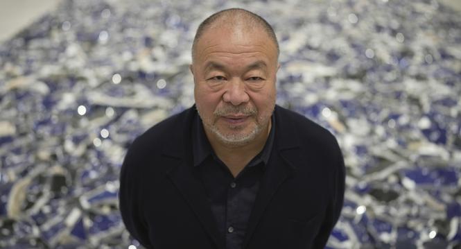 Dissident Chinese artist and activist Ai Weiwei poses for a photograph at his exhibition "Making Sense" at the Design Museum, in London, Tuesday, April 4, 2023. (AP Photo/Kin Cheung)
