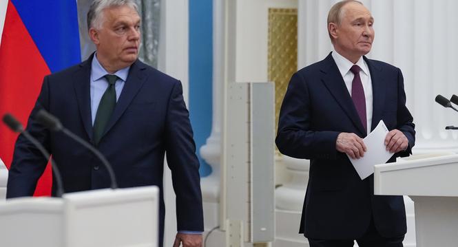 Russian President Vladimir Putin, right, and Hungarian Prime Minister Viktor Orban arrive to make press statements after their talks in the Kremlin in Moscow, Russia, Friday, July 5, 2024. Hungarian Prime Minister Viktor Orban visited Moscow on Friday for