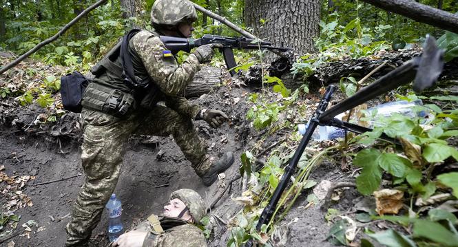 Ukrainian soldiers from the 3rd Spartan Task Force Brigade are taking part in tactical and medical training exercises at an undisclosed location in Kharkiv region, Ukraine, Monday, July 22, 2024. (AP Photo/Andrii Marienko)